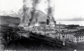 The Navy barracks in Dutch Harbor burn after they were struck by Japanese bombs on 4 June, 1942.