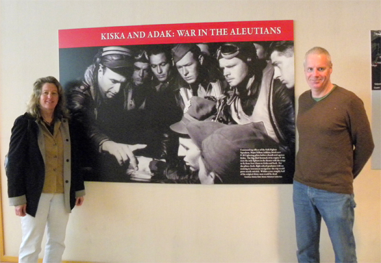 Exhibit organizers in front of exhibit introductory panel