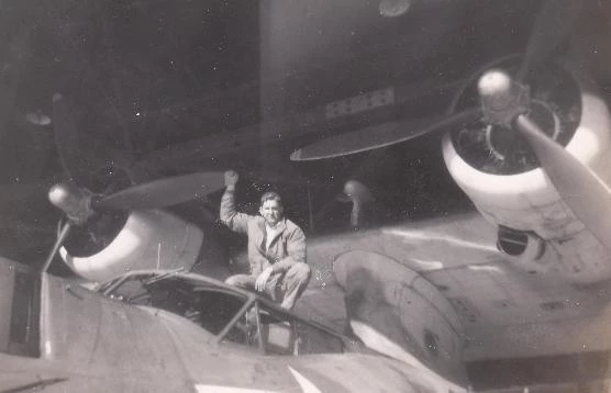 A captain crouches on his plane