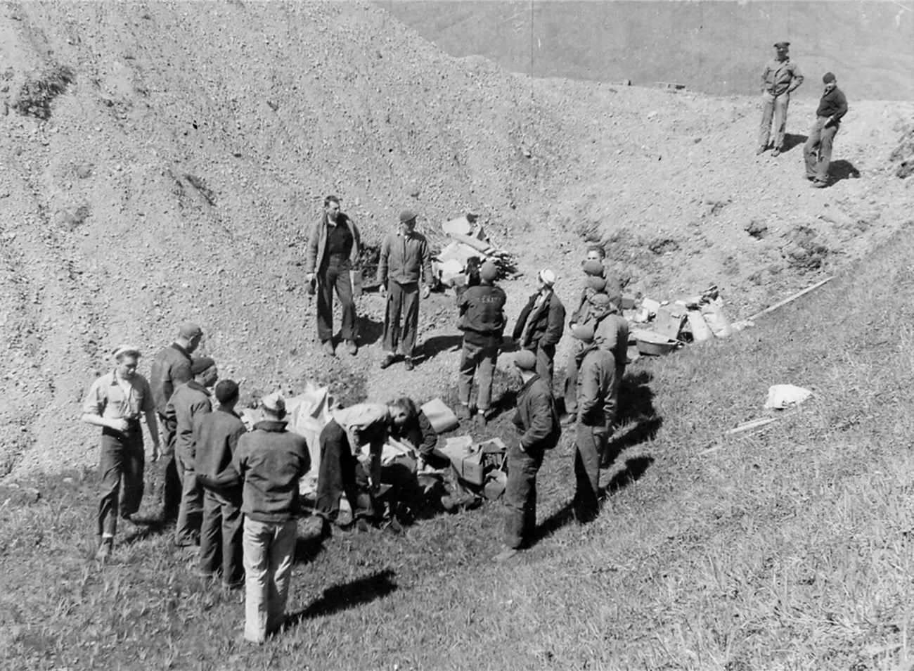 Men on Attu celebrate VJ Day with a picnic and beer