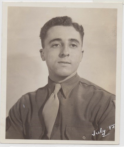 a portrait of a man in uniform. handwritten text says July '45