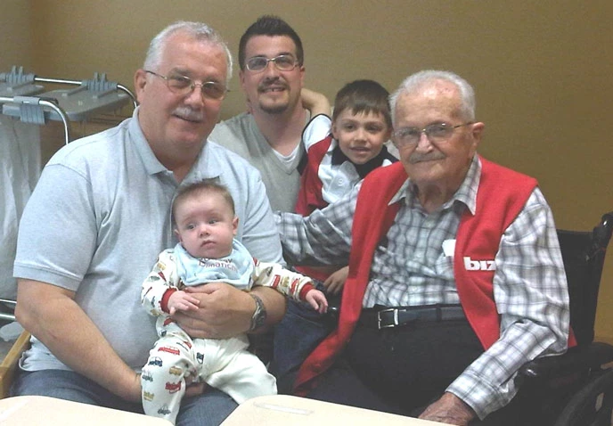 Desjardin family a baby, a young boy, and three men of varying generations