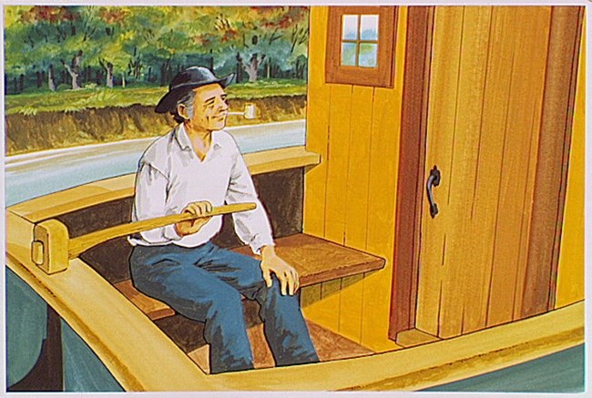 A man at the rudder of a canal boat.