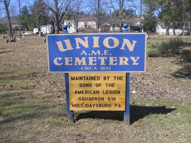 A blue sign that says Union AME Cemetery