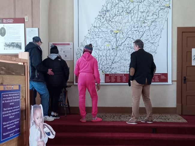 People looking at museum exhibits