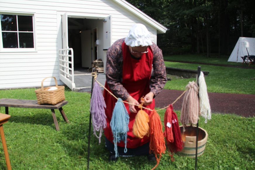 A costumed park ranger presenting a natural dyes program. A costumed park ranger presenting a natural dyes program.