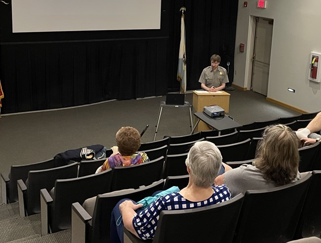 A park ranger presents a program.