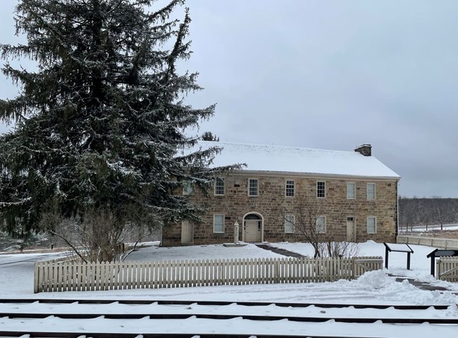 A stone tavern in the snow