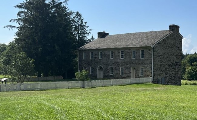 A stone tavern from the side.