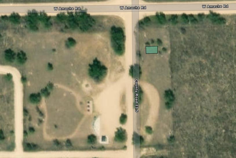 Zoomed in map of park entrance area. A small teal square to the right of the entrance road notes the assembly and distribution area.