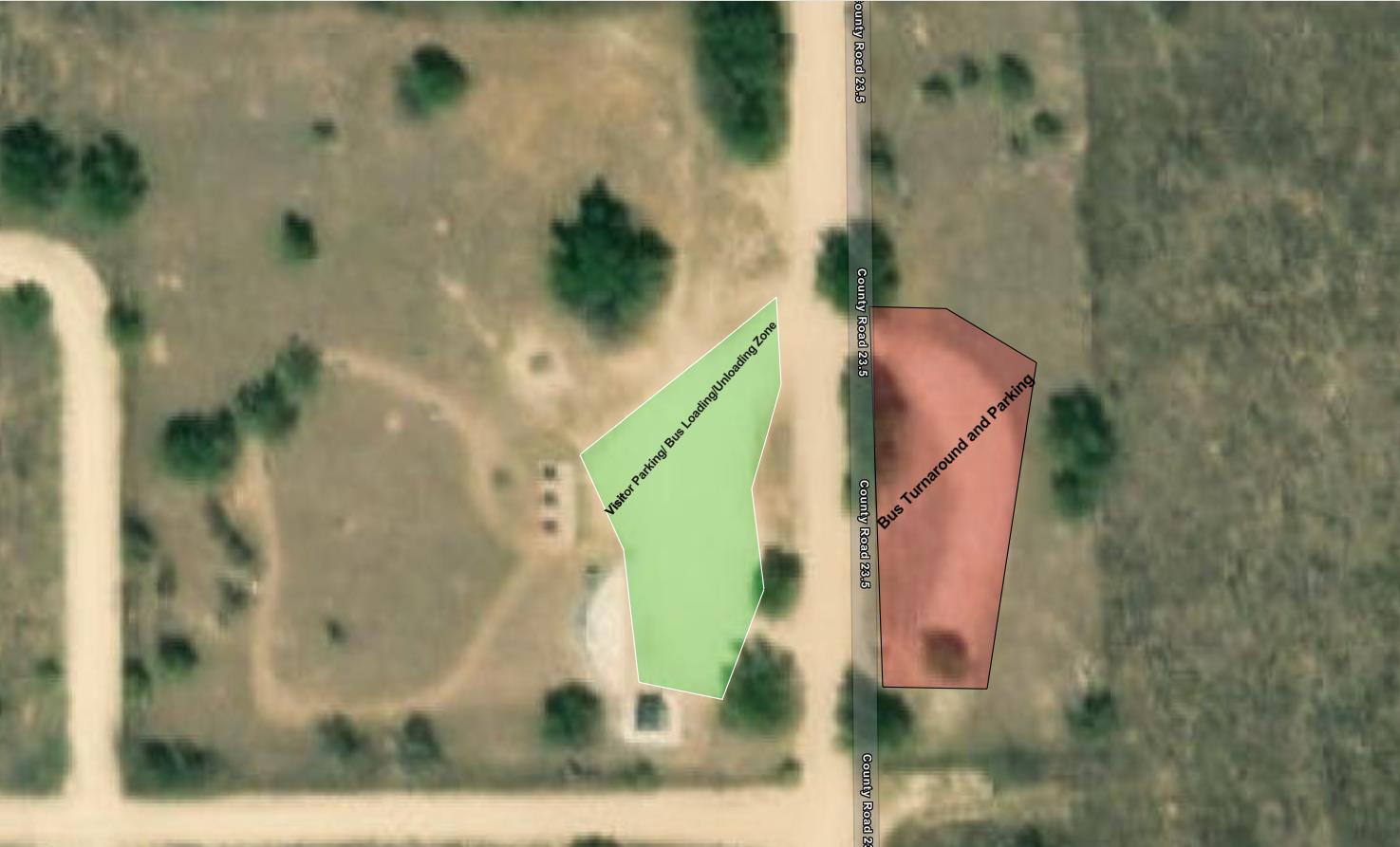 Zoomed in map of the park entrance. To the right of the entrance road is a red polygon that is labeled at "bus turnaround and parking." To the right of the road, a green polygon is labeled "visitor parking, bus loading/unloading zone."