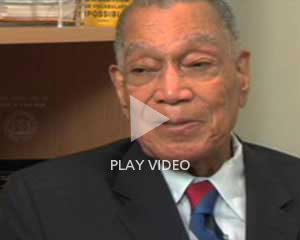 video still overlaid with words 'Play Video'