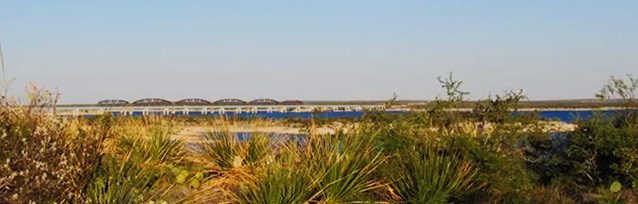 View of highway and railroad bridges over reservoir from Diablo East trail.
