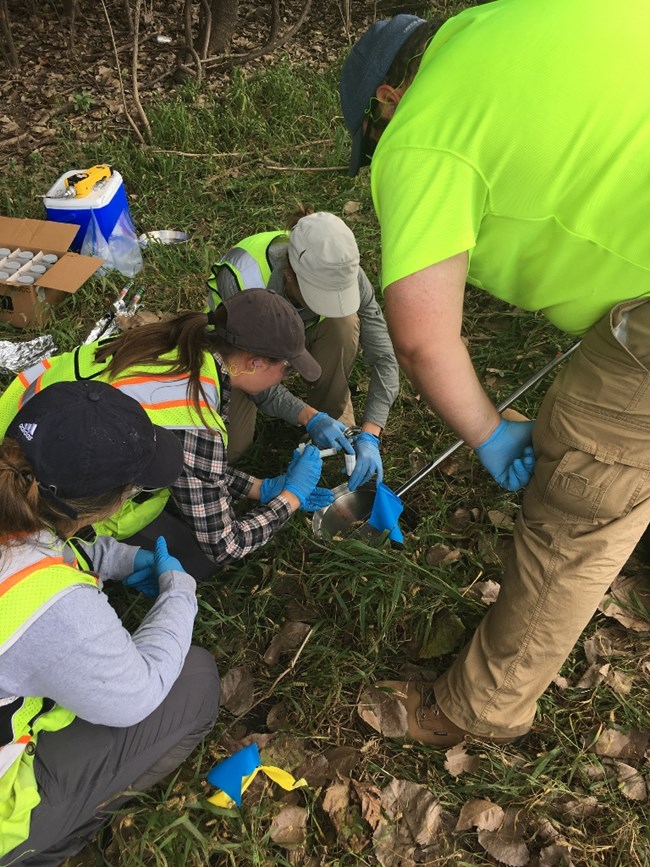 Researchers collecting soil samples at Poplar Point Site