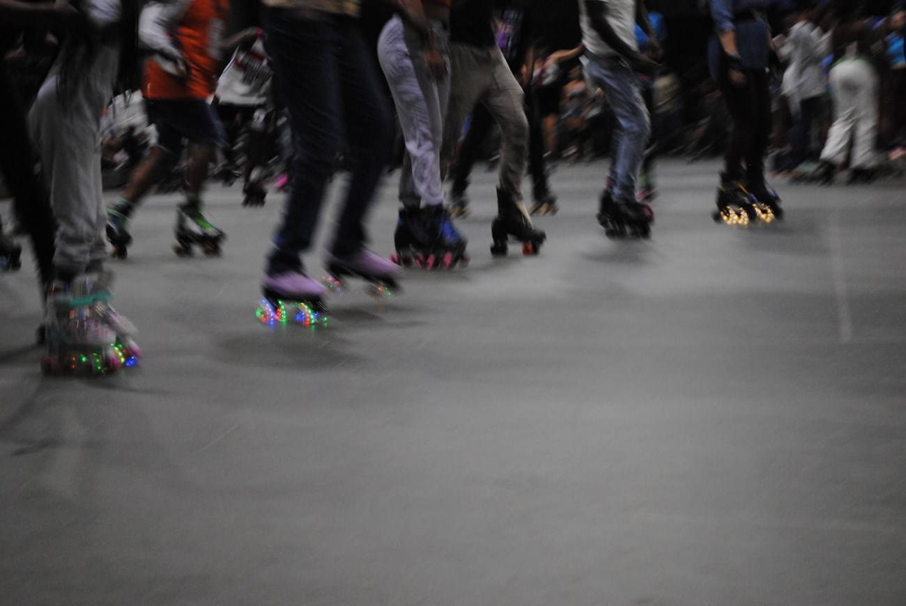 Skates light up on the skating rink floor
