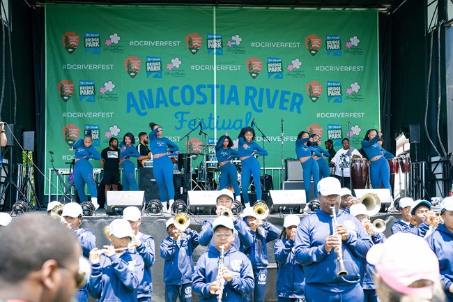 people on stage at the Anaocostia River Festival