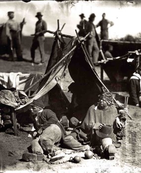 Living history volunteers pose as Union Prisoners of War