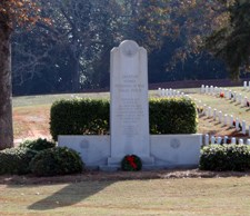 Stone monument decorated with a Christmas wreath