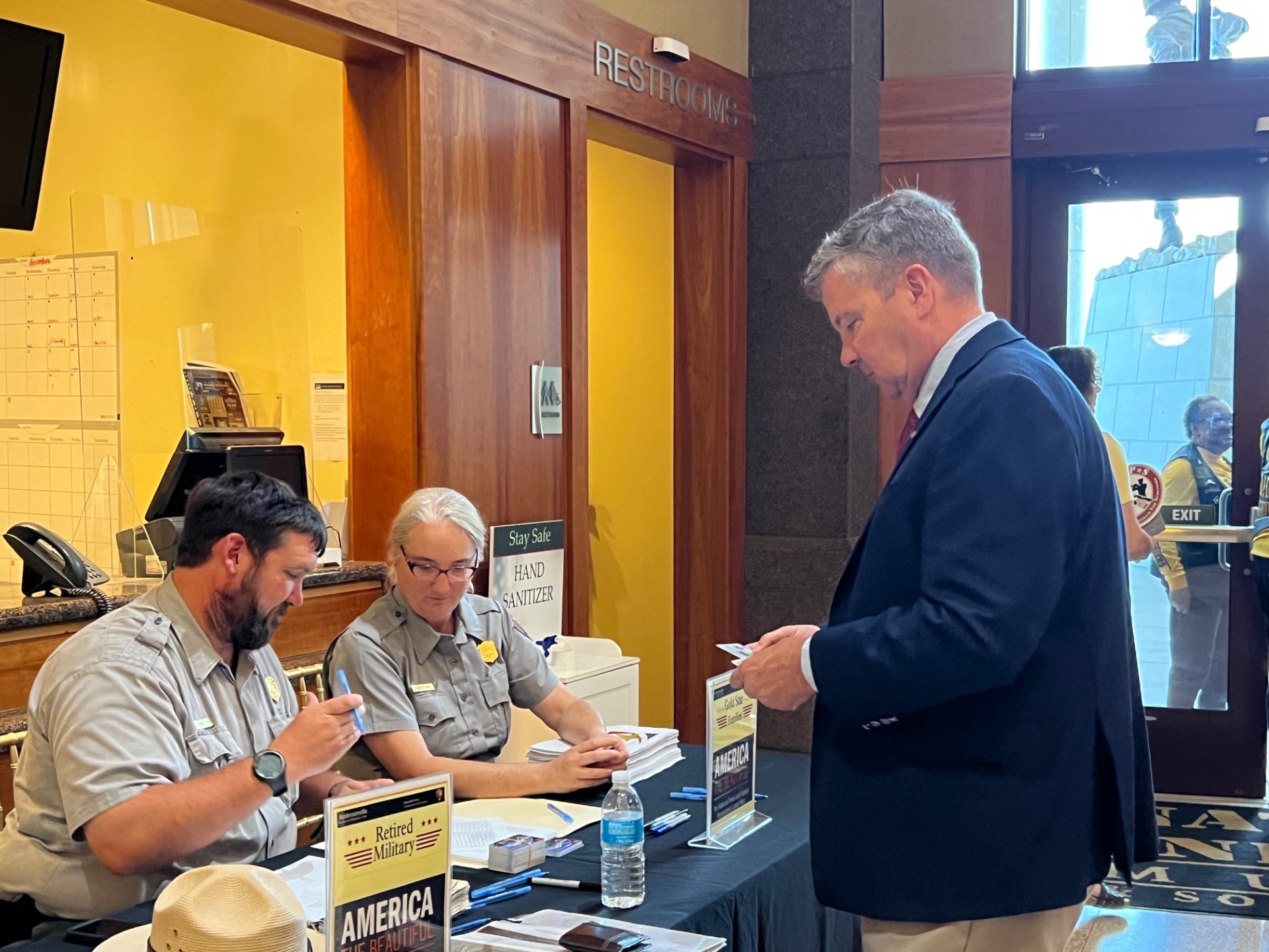 Park Rangers handing out veterans pass to Andrew Redmond  Col (Ret), USAF Executive Vice President and Chief Operating Officer National Infantry Museum Foundation