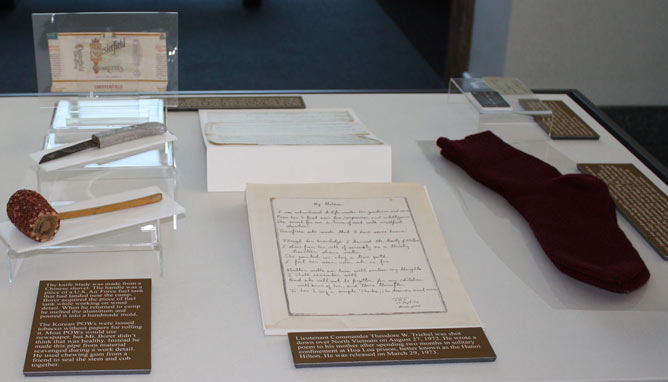 Photograph of artifacts in an exhibit case.