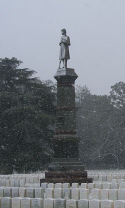 Falling snow coats a Civil War monument. Falling snow coats a Civil War monument.