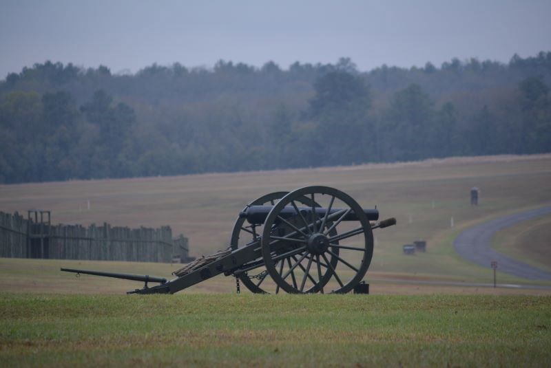 Cannon with prison gate in background