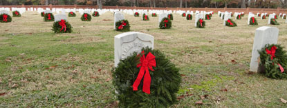 Wreaths distributed among white headstones. Wreaths distributed among white headstones.
