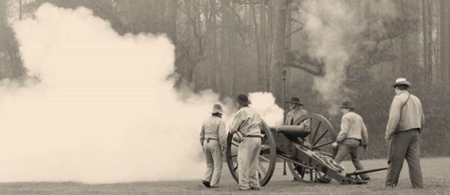Living historians demonstrate firing a cannon