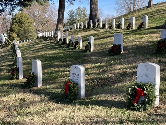 Wreaths Across America with wreaths on veteran stones