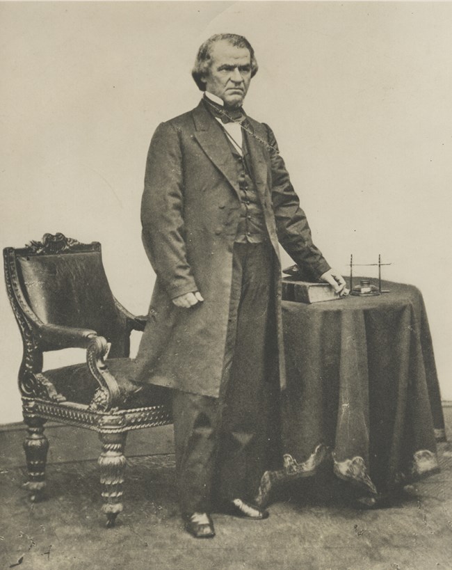 Andrew Johnson by desk
