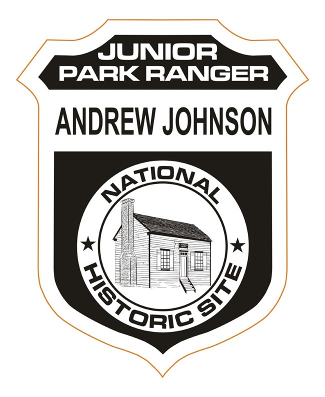 A black and white junior ranger badge with tailor shop