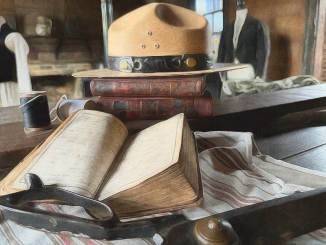A flat hat in Johnson's Tailor Shop with an open book and scissors