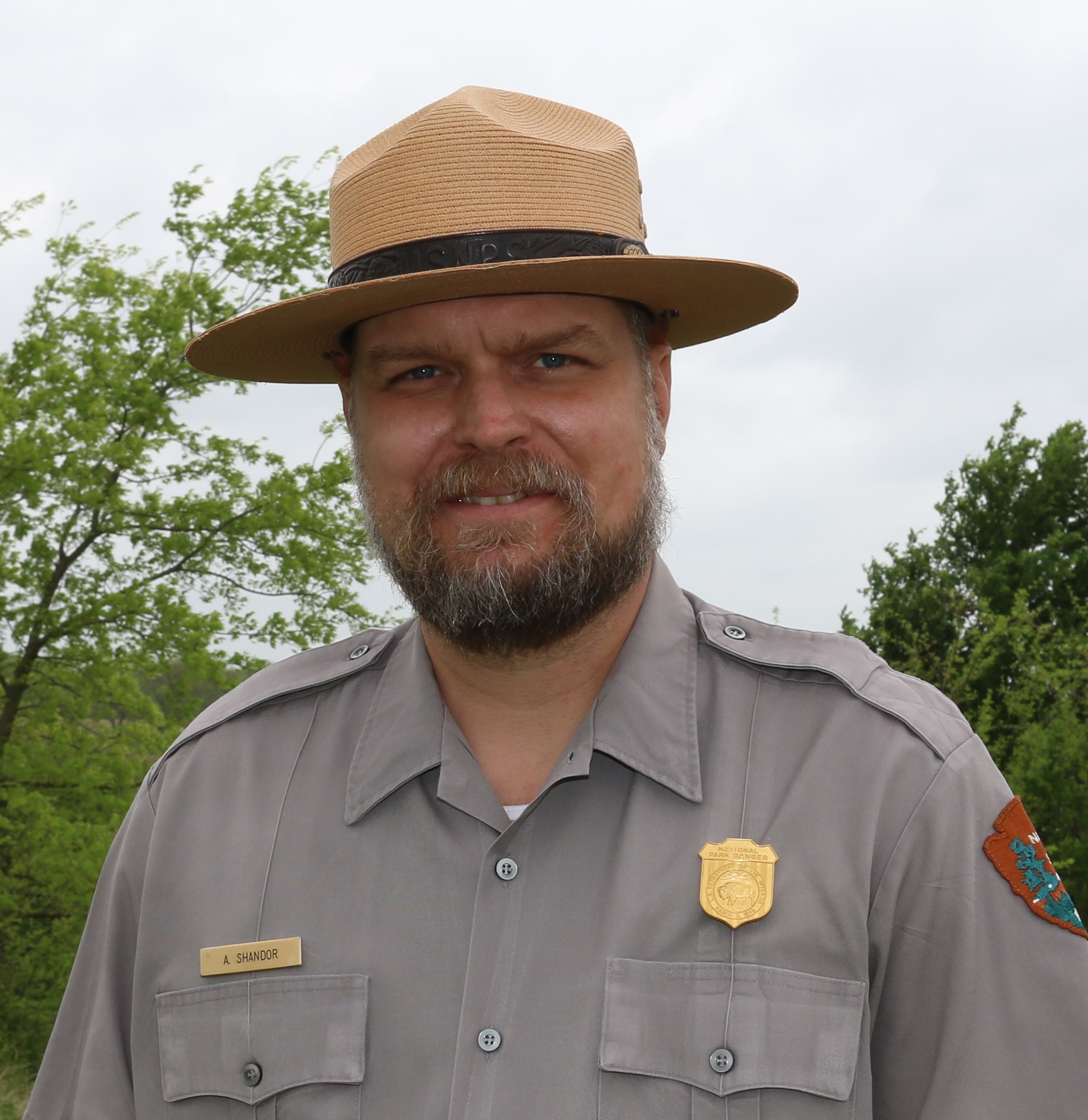 Shandor headshot in uniform with flat hat