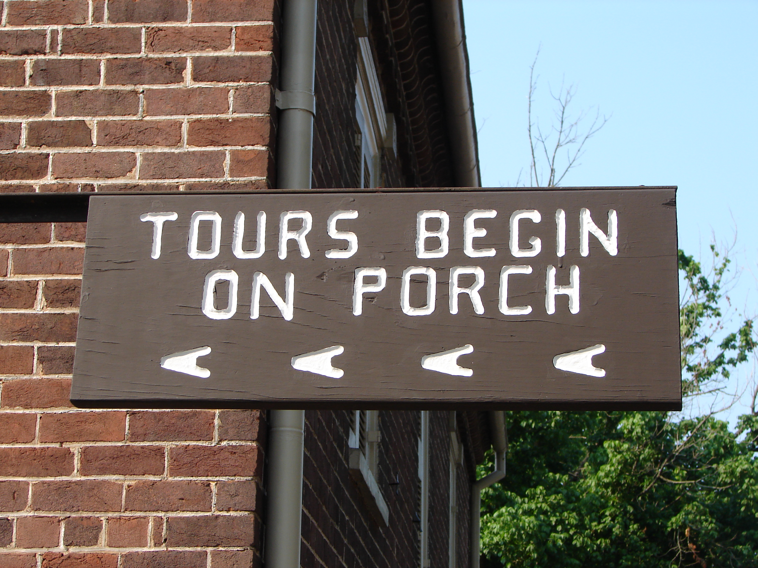 Tour sign Tours begin on porch sign