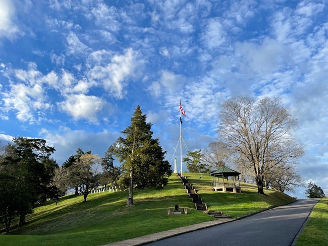 View of Monument Hill with flag, gazebo, and obelisk
