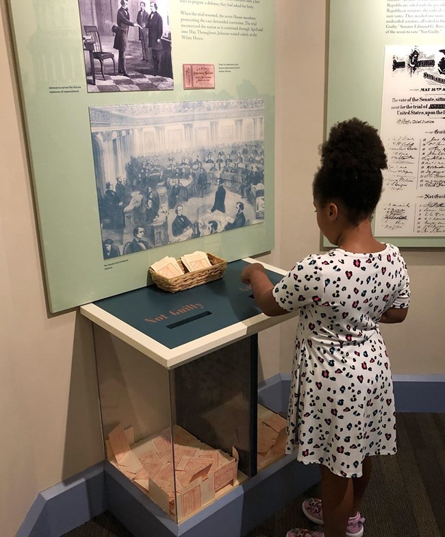 A young girl votes in the impeachment exhibit