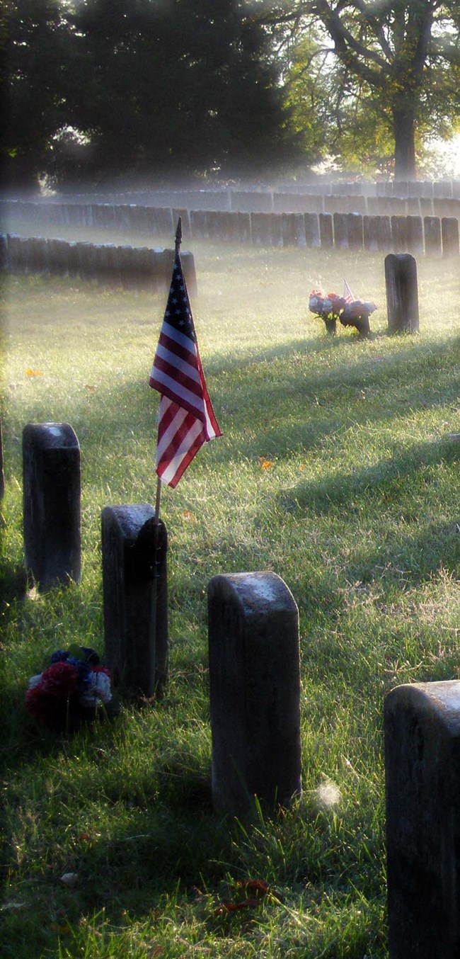 flag on a foggy placed on a grave