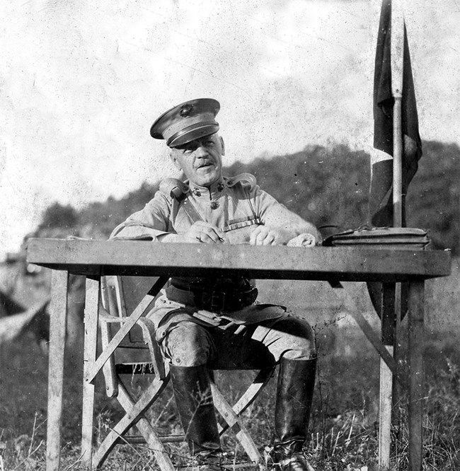 Brig. Gen. Dion Williams sits at his field desk