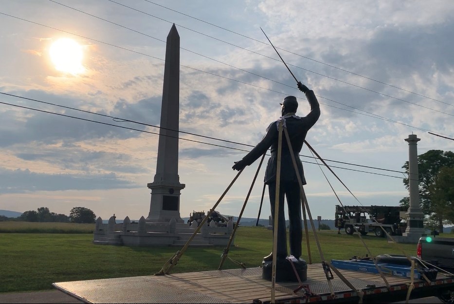 soldier monument on flatbed truck