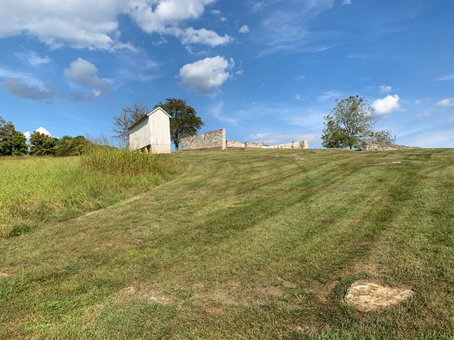 stone foundation shows area of the barn