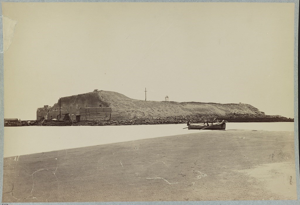 Photo of the exterior of Fort Sumter after months of Union bombardment showing extensive damage.