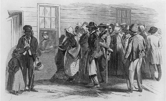 Print shows African Americans gathered outside the Freedmen's Bureau in Richmond, Virginia. A woman is handing a slip of paper through a window to a man seated inside.