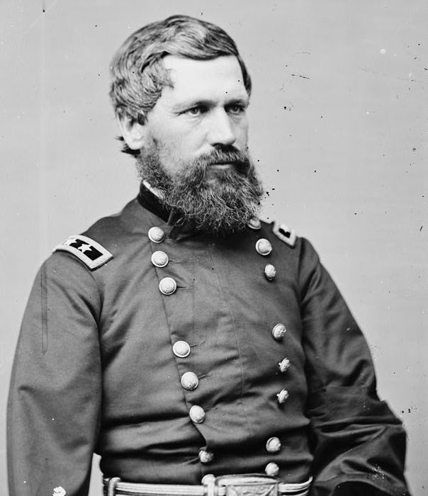 man in dress blue union army coat black hair and beard