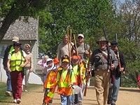 Cub Scouts prepare to pick up trash in the park. Cub Scouts prepare to pick up trash in the park.