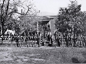 Photograph of the courthouse with provost guards (Federal soldiers) and village residents, late summer 1865.