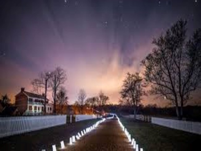 Richmond-Lynchburg Stage Road with luminaries on both sides  of the road.