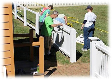 Fence Painters Volunteers painting fence