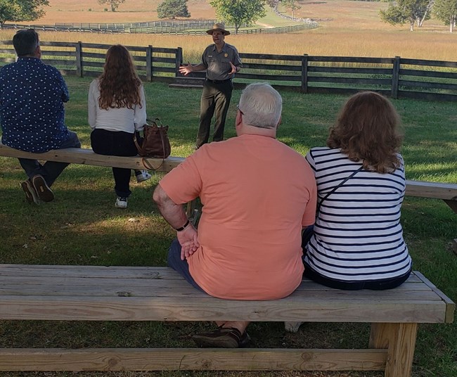 Ranger giving a talk to visitors.