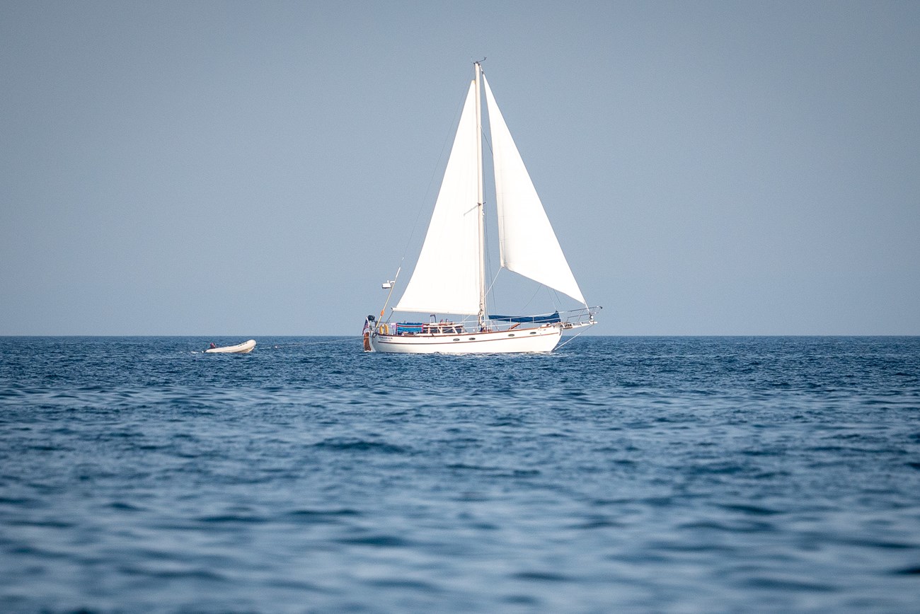 Photograph of sailboat on water.