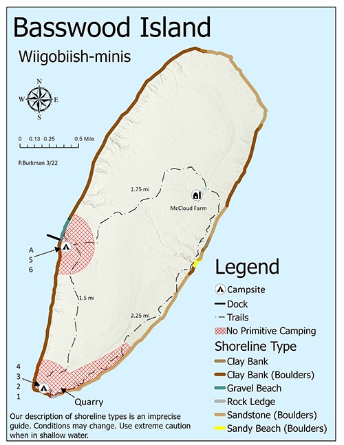 A map of Basswood Island showing trails, shoreline, topography, and primitive camping zones.